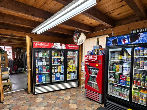 The cooler room: Budweiser and Pepsi coolers stocked with beer, soda and energy drinks